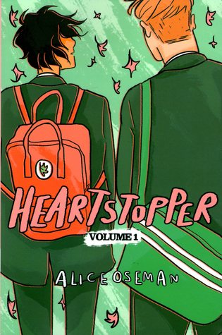 Heartstopper-Volume-1-by-Alice-Osterman.--Two-boys-in-backpacks-walking-away,-the-shorter-one-is-looking-up-at-the-taller-one,-as-leaves-fall-around-them-